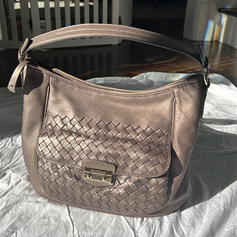 Cole Haan - metallic gray, pewter hobo bag. Zip top. Front pocket.
